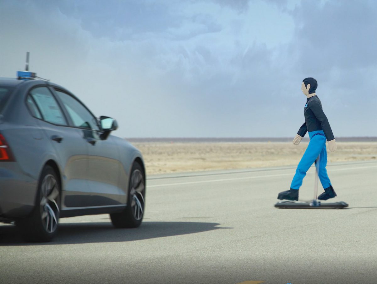 A car approaches a pedestrian dummy